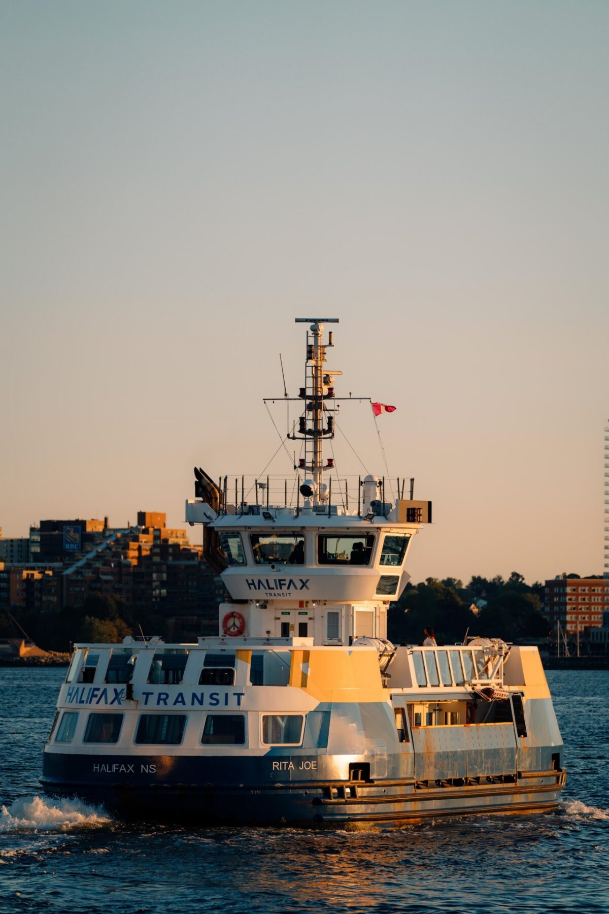 Halifax Transit ferry Rita Joe travelling across Halifax Harbour during golden hour.