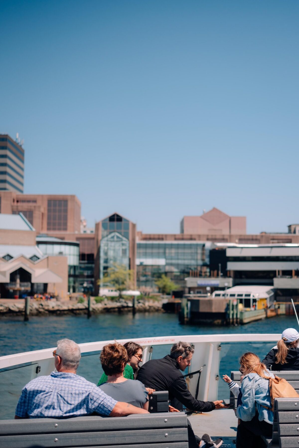 Passengers aboard a Halifax Transit ferry approaching Alderney Landing terminal in Downtown Dartmouth.